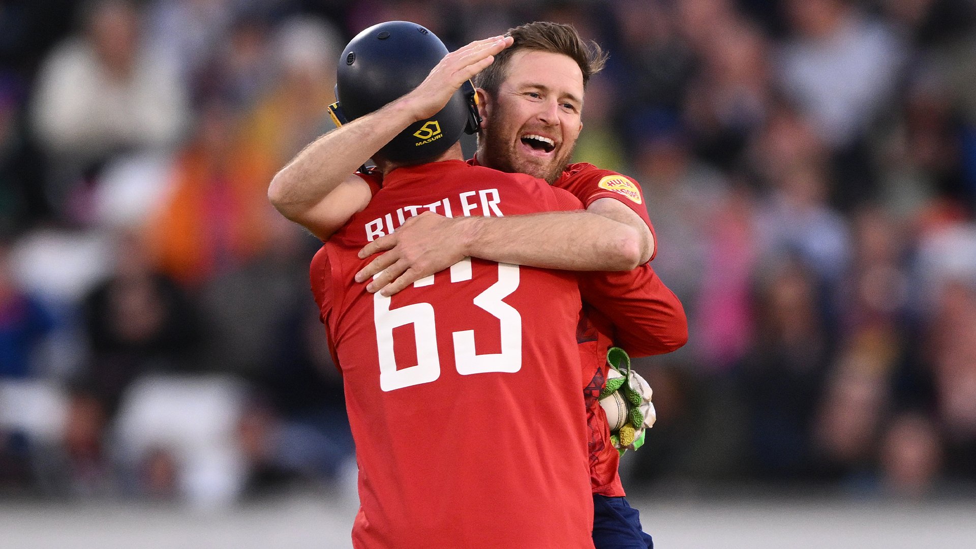 Liam Dawson celebrates with Jos Buttler after getting one of his four wickets during the ENG vs WI first T20I at Durham.